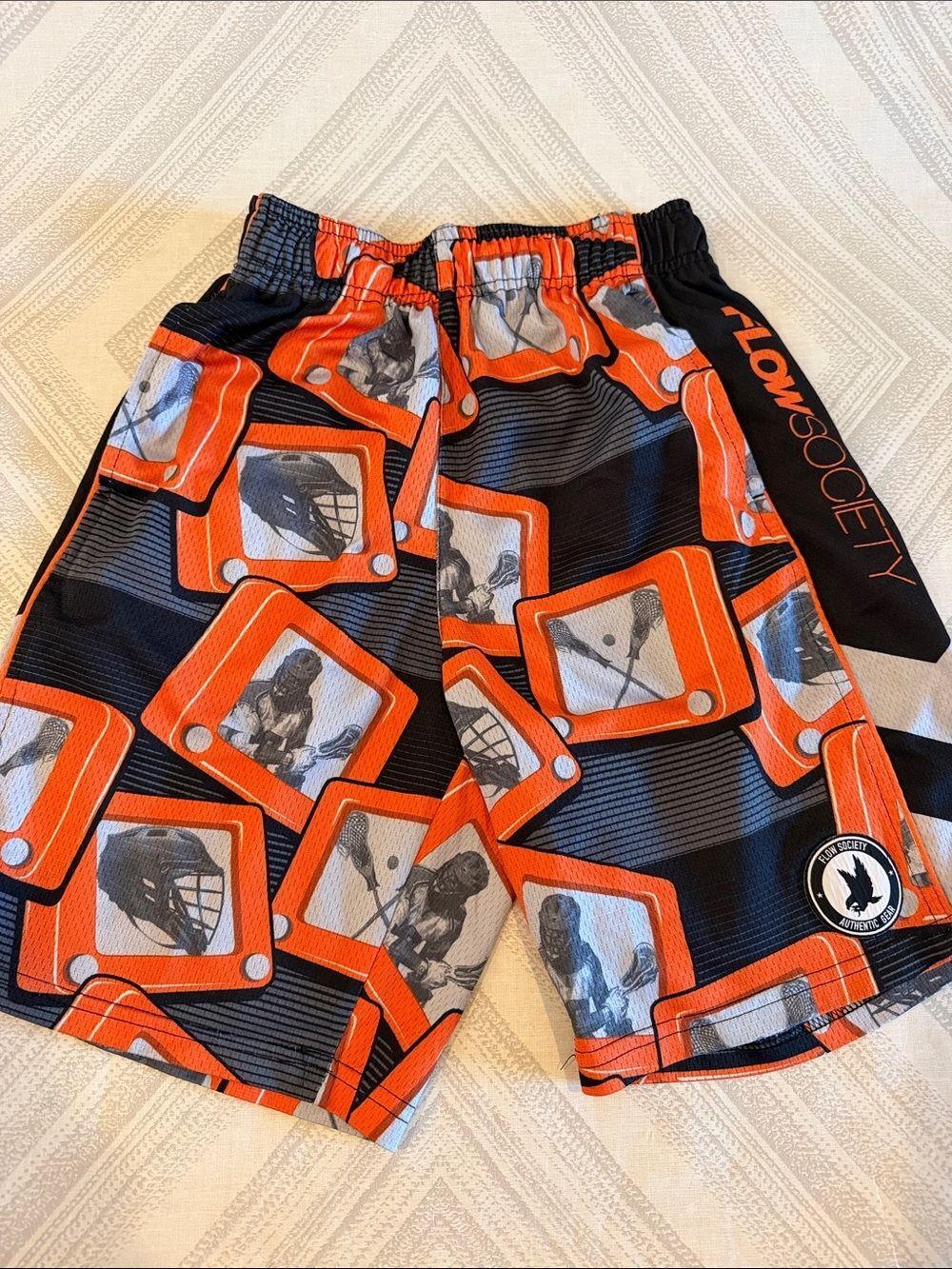 Flow Society Boys Medium Black Lacrosse Graphic Athletic Shorts with Orange